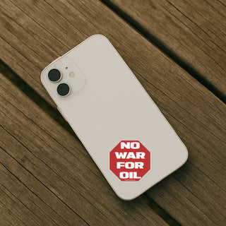 Phone with 'No War for Oil' sticker on a wooden surface