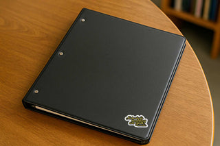 Sticker with text 'Nobody is treading on you, sweetie' on a black notebook