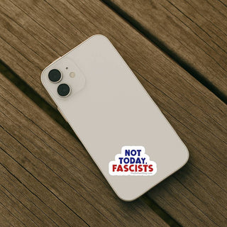 Sticker reading “Not today, fascists” on the back of a light-colored smartphone