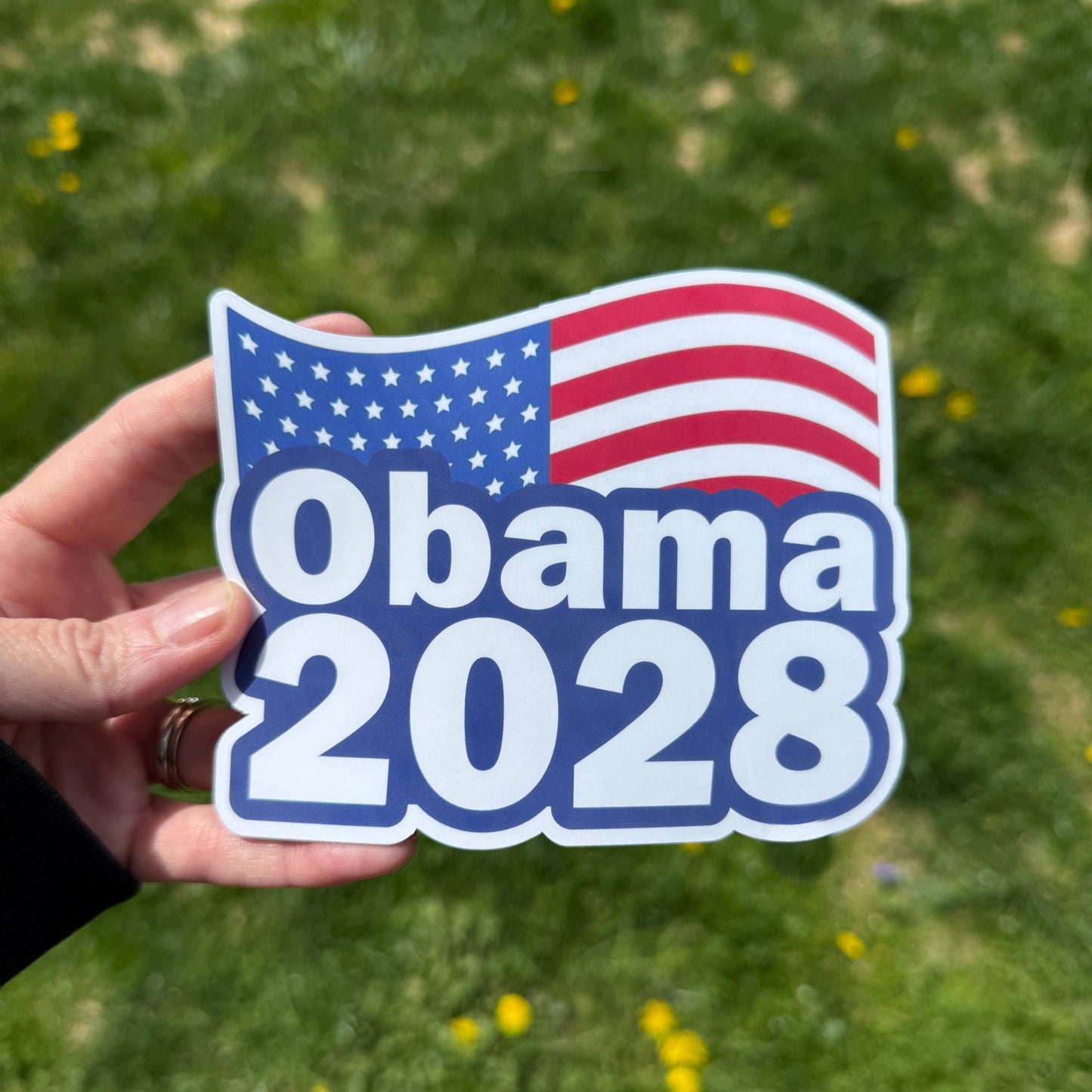 Obama 2028 magnet held in hand showing support for a future presidential campaign.