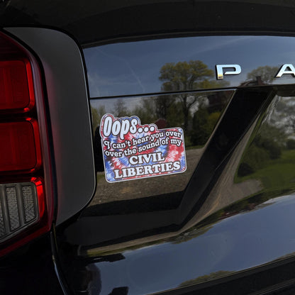 A colorful tie-dye magnet or vinyl decal with bold black text that says "Oops I Can't Hear You Over the Sound of My Civil Liberties," designed for cars, laptops, and more.
