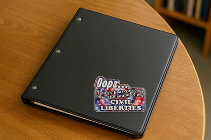 'Oops I Can't Hear You Over the Sound of My Civil Liberties' magnet or vinyl decal with a red white and blue tie dye background displayed with a slight shadow on a white background. A bold, high-quality political sticker perfect for cars, laptops, fridges, or toolboxes. Great for activists, protestors, or anyone fed up with fascism.
