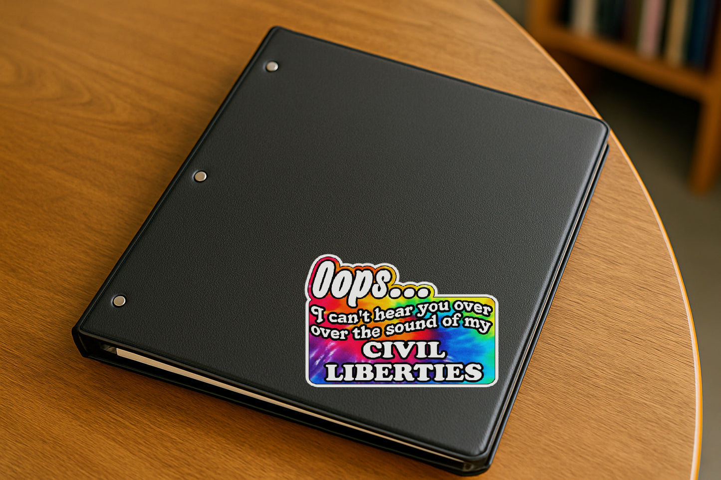 'Oops I Can't Hear You Over the Sound of My Civil Liberties' magnet or vinyl decal with a rainbow tie dye background displayed with a slight shadow on a white background. A bold, high-quality political sticker perfect for cars, laptops, fridges, or toolboxes. Great for activists, protestors, or anyone fed up with fascism.