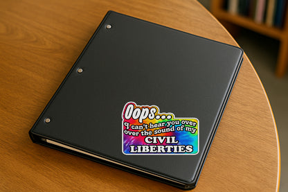 'Oops I Can't Hear You Over the Sound of My Civil Liberties' magnet or vinyl decal with a rainbow tie dye background displayed with a slight shadow on a white background. A bold, high-quality political sticker perfect for cars, laptops, fridges, or toolboxes. Great for activists, protestors, or anyone fed up with fascism.
