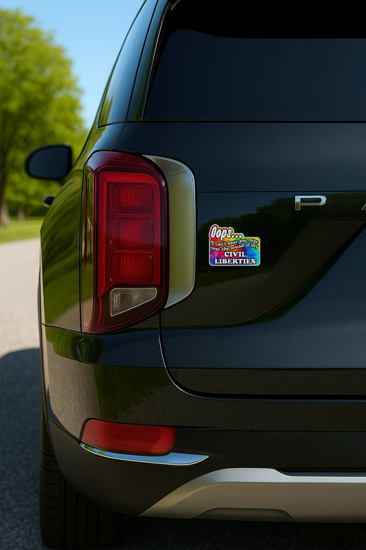 'Oops I Can't Hear You Over the Sound of My Civil Liberties' magnet or vinyl decal with a rainbow tie dye background displayed on the back of a black SUV. A bold, high-quality political sticker perfect for cars, laptops, fridges, or toolboxes. Great for activists, protestors, or anyone fed up with fascism.