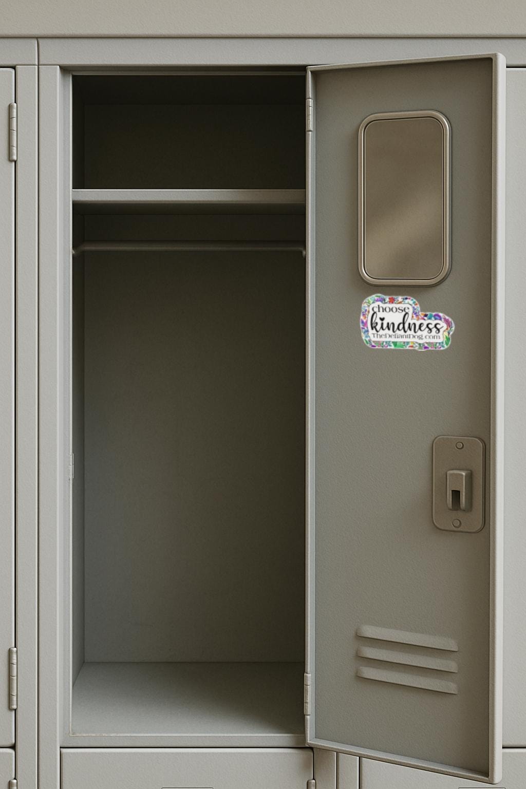sticker that says choose kindness and thedefiantdog.com on the inside of a locker door.
