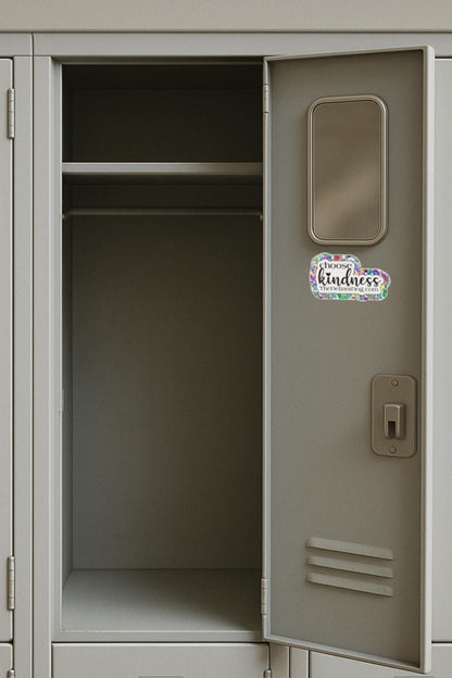 sticker that says choose kindness and thedefiantdog.com on the inside of a locker door.