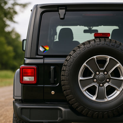 Black SUV with spare tire and colorful logo on rear window