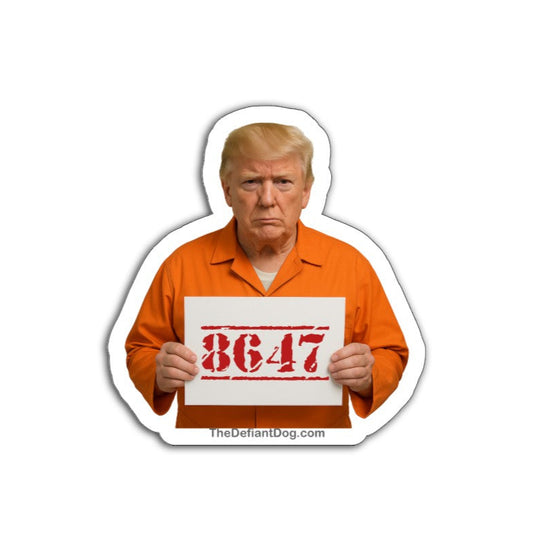Illustration of Donald Trump in an orange prison jumpsuit holding a sign that reads “8647,” referencing him as the 47th president; image includes TheDefiantDog.com at the bottom.