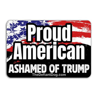 A high-resolution digital graphic of a rectangular vinyl decal. The top half features a distressed American flag design, and the bottom half is solid black. Bold white text reads "Proud American" in the center and "ASHAMED OF TRUMP" along the bottom. The website "TheDefiantDog.com" is printed in small text at the very bottom.