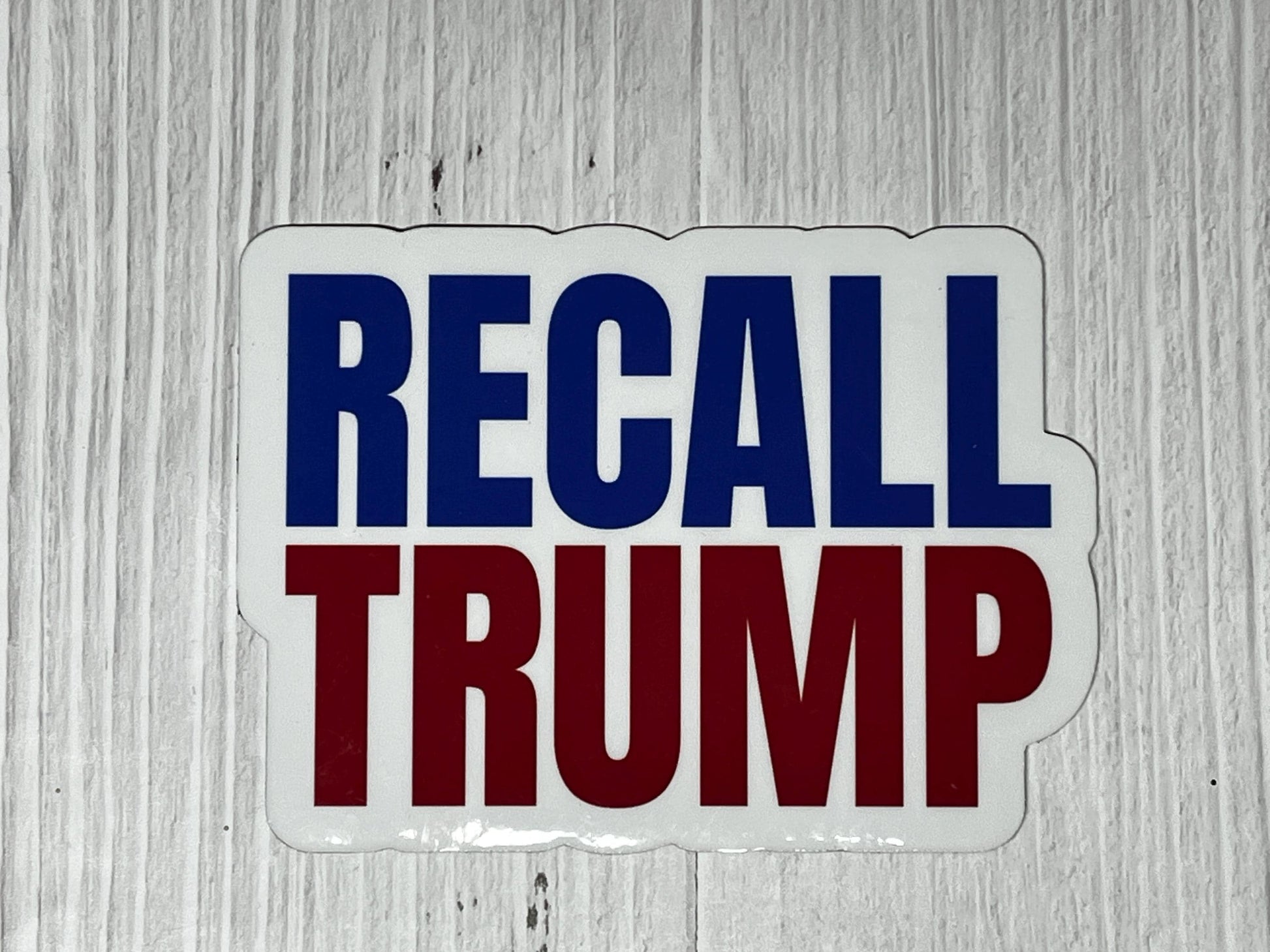 Recall Trump magnet shown on a table as a bold protest message against authoritarianism
