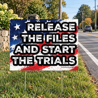 Release the Files and Start the Trials political protest yard sign displayed along a roadside. Bold red, white, and blue American flag design demanding Epstein files transparency, justice, and accountability. Anti-corruption political lawn sign for peaceful demonstrations.