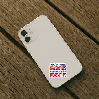 Phone case with text design on a wooden surface