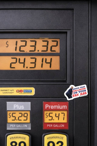 Funny Donald Trump White House ballroom political sticker applied to a black gas pump near the fuel price display, showing the Shove That Ballroom Up Your Fat Ass protest design.