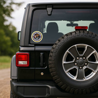 Political satire resistance sticker displayed on the rear window of a black Jeep with navy and yellow government seal parody design.