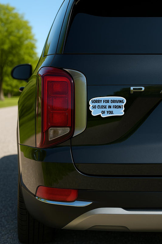 Blue and black sticker that says “Sorry for Driving So Close in Front of You” in bold text.