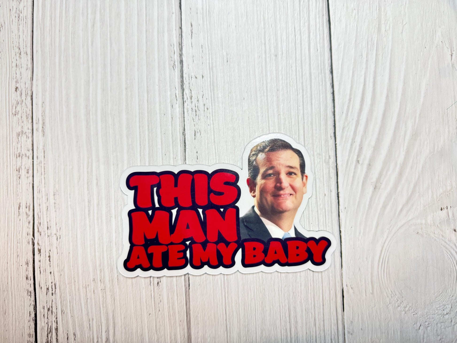 This man ate my baby magnet with Ted Cruz’s image displayed on a table, blending meme culture with political commentary.