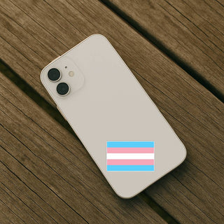 Phone with a transgender flag sticker on a wooden surface