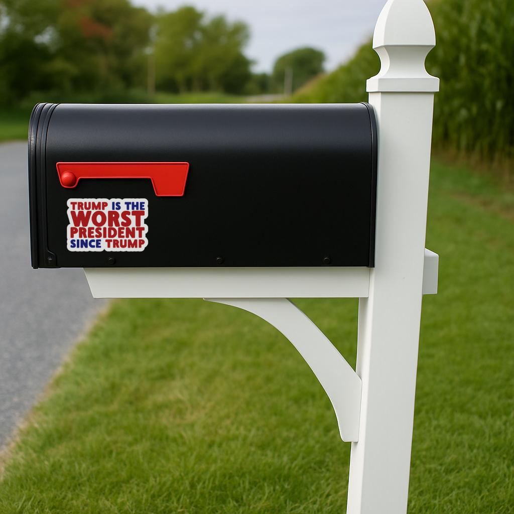 Sticker with text 'TRUMP IS THE WORST PRESIDENT SINCE TRUMP' in red and blue on mailbox