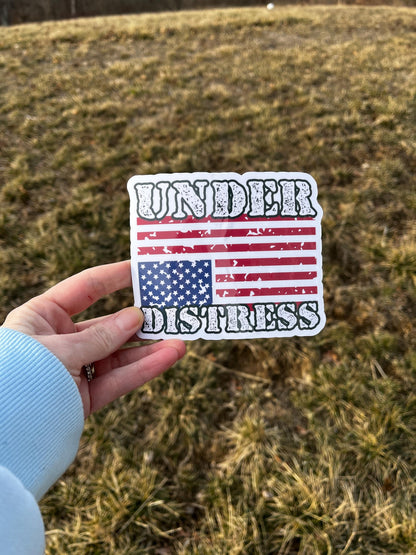 Under Distress magnet with an upside-down American flag held in hand, representing protest and urgent political resistance.
