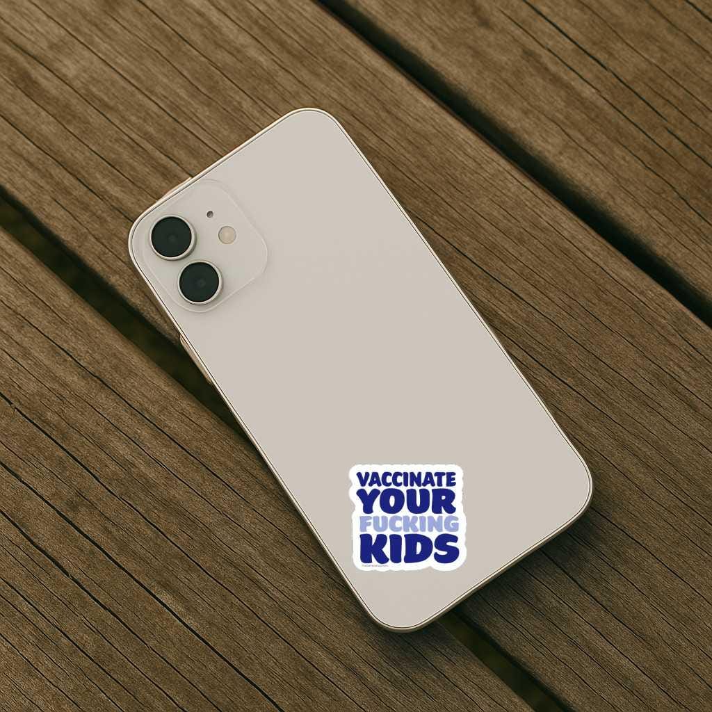 Phone with a sticker reading 'Vaccinate Your Fucking Kids' on a wooden surface