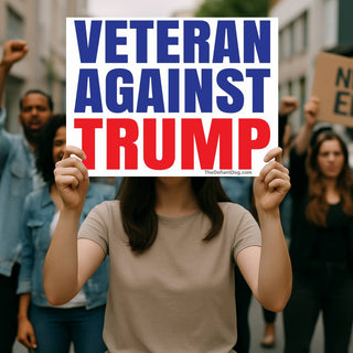 Protester holding Veteran Against Trump sign at an outdoor political demonstration, displaying oversized blue Veteran Against lettering and bold red Trump text.
