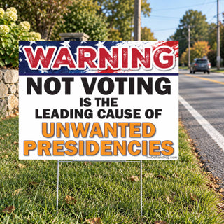 Funny political voting rights yard sign displayed on metal stakes beside a suburban road, featuring the Warning Not Voting Is the Leading Cause of Unwanted Presidencies message.