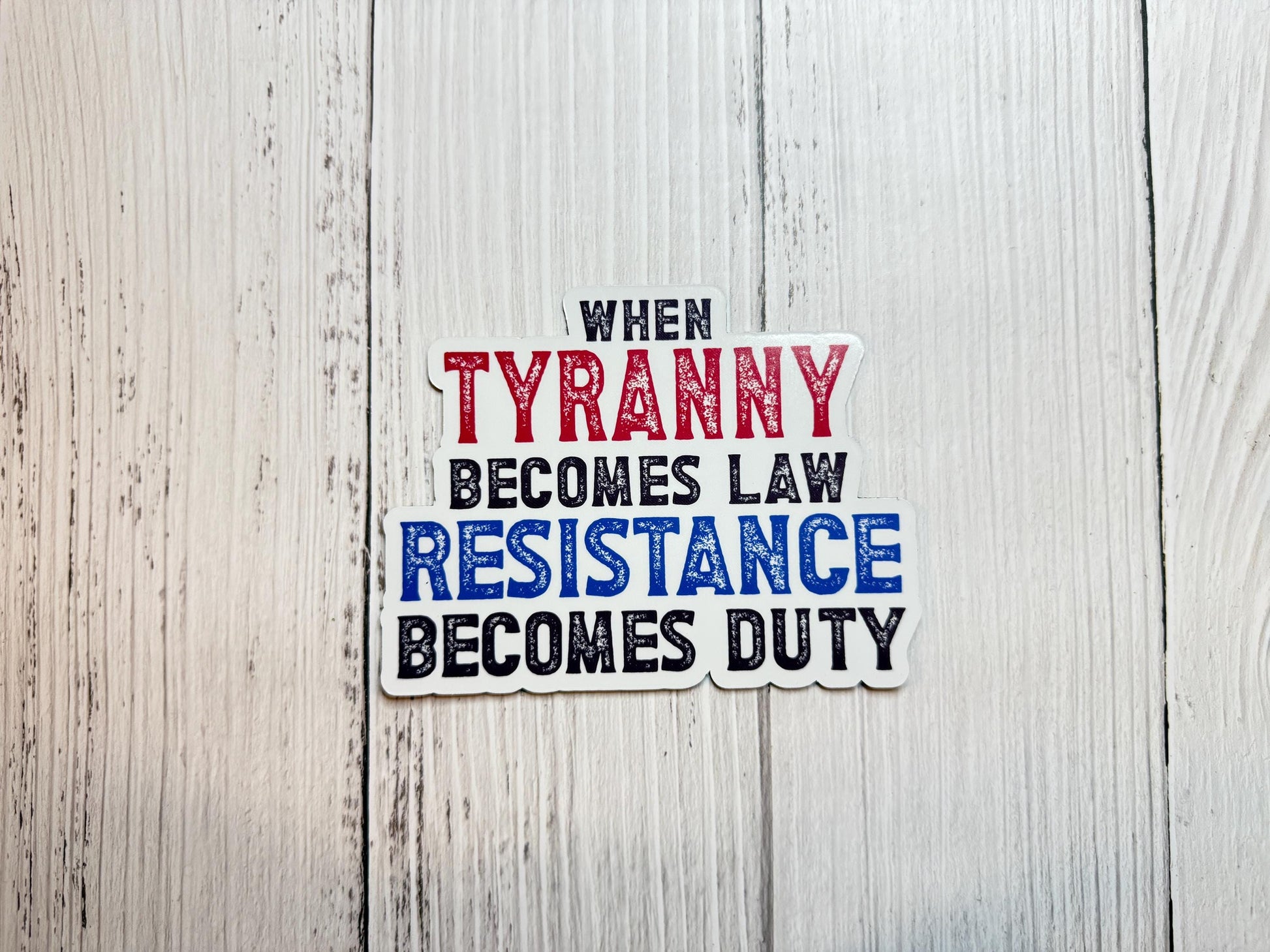A bold magnet or vinyl decal that reads “When Tyranny Becomes Law, Resistance Becomes Duty” in striking, attention-grabbing font.