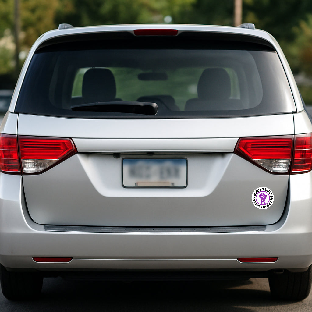 'Women's Rights Are Human Rights' magnet or vinyl decal displayed on the back of a silver minivan. A bold, high-quality political sticker perfect for cars, laptops, fridges, or toolboxes. Great for activists, protestors, or anyone fed up with fascism.