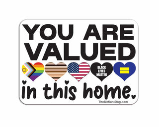 Close-up product image of You Are Valued In This Home sticker featuring LGBTQ pride rainbow heart, inclusive equality symbols, Black Lives Matter heart, and bold welcoming typography.