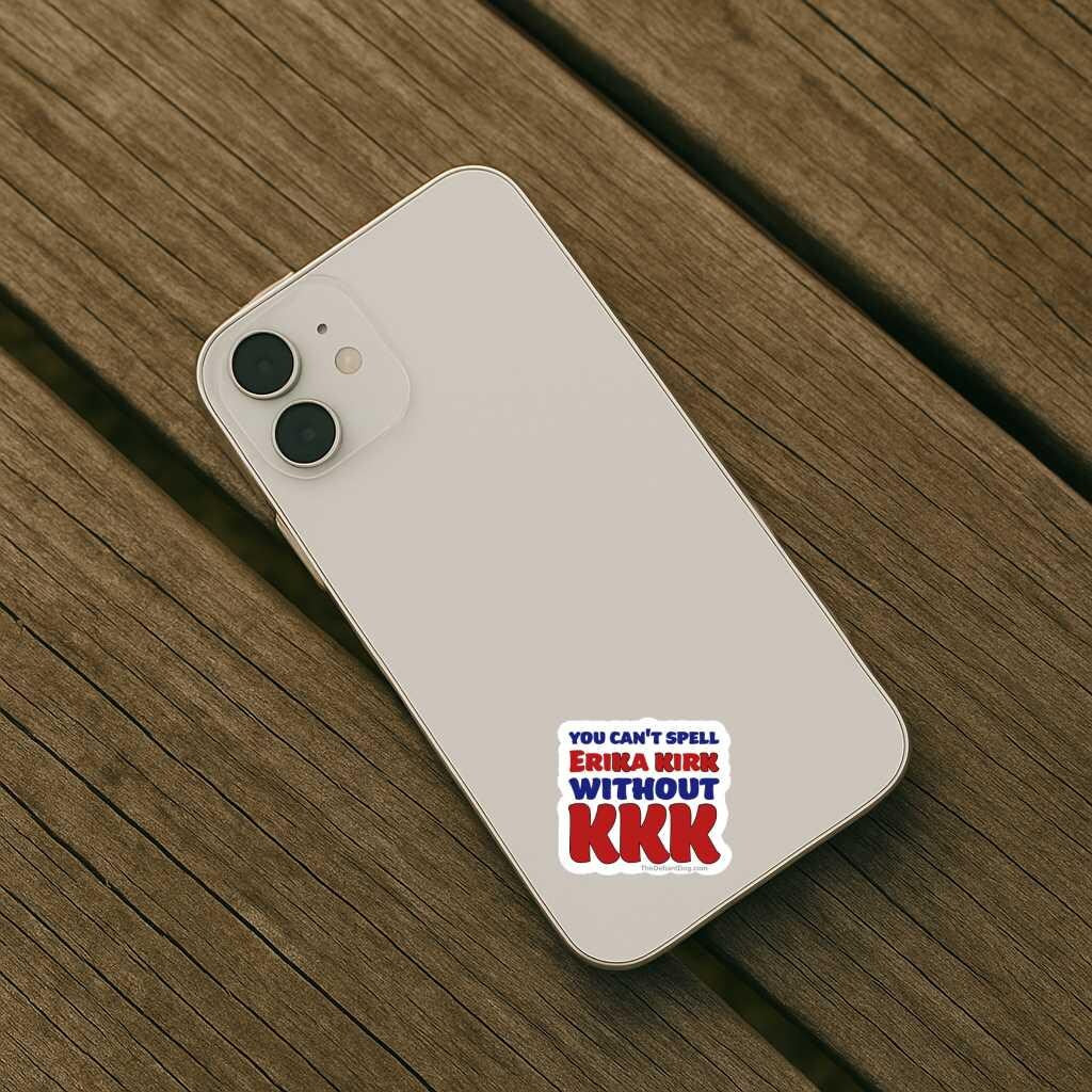 Phone case with a political message on a wooden surface