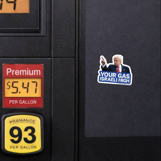 Your Gas Israeli High Trump sticker displayed on a black gas pump beside gasoline price displays, showing the anti-Trump political design with Donald Trump pointing and blue-and-white text.