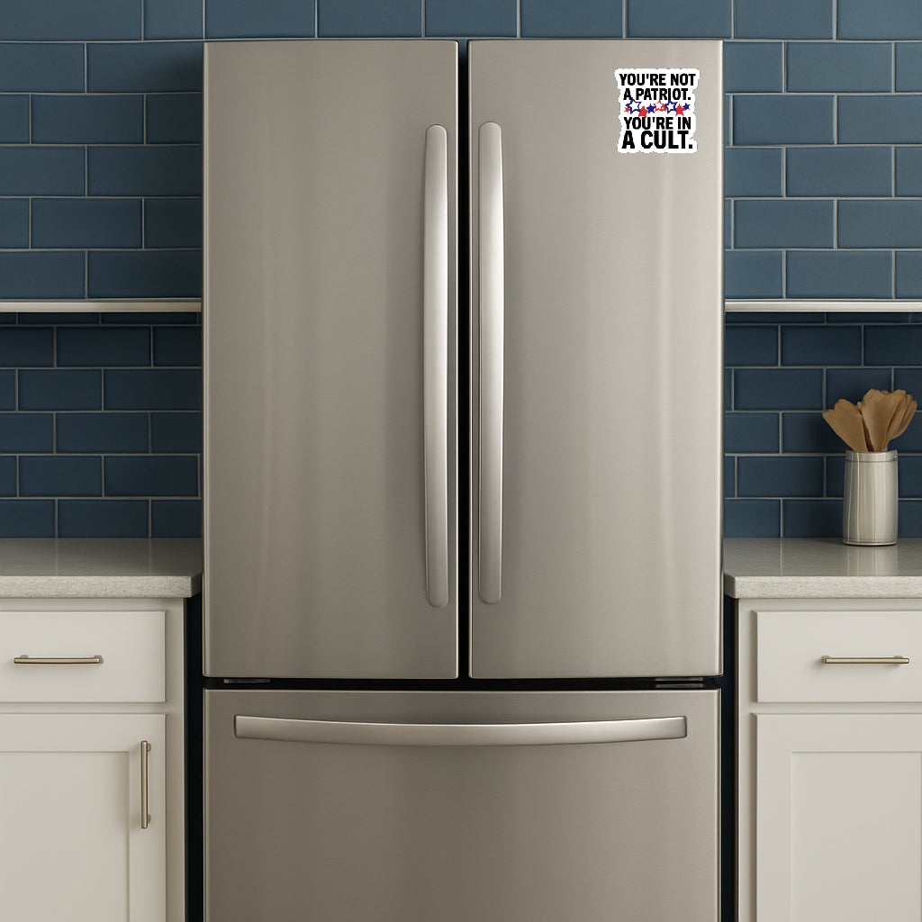 'You're Not a Patriot  You're in a Cult' magnet or vinyl decal displayed on a stainless steel refrigerator. A bold, high-quality political sticker perfect for cars, laptops, fridges, or toolboxes. Great for activists, protestors, or anyone fed up with fascism.